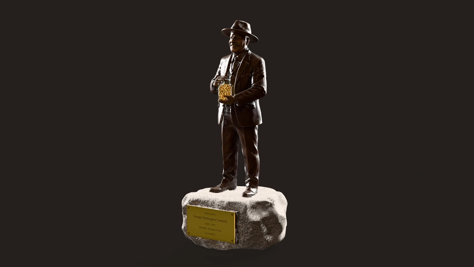 The bronze George Carmack statue on a light granite boulder: hat, suit, the clear glass full of gold nuggets in his hands, the brass plaque at the front